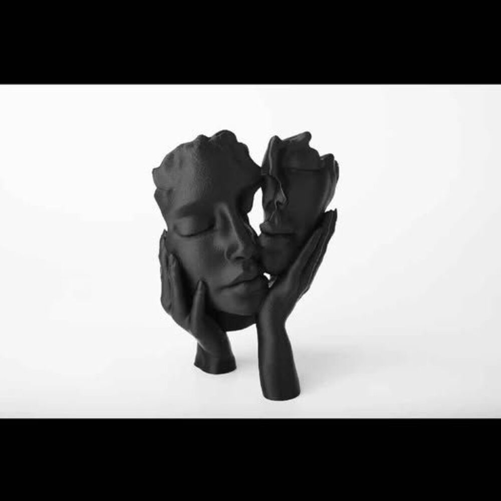 Black Abstract Faces Sculpture